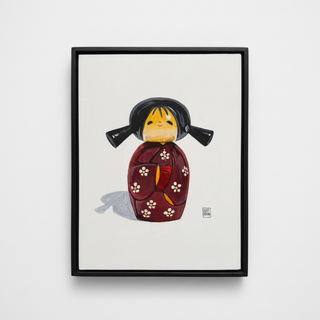 Framed artwork of a traditional Japanese doll on a white background
