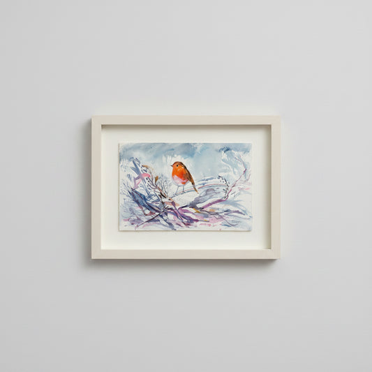 Framed artwork of a bird on a branch against a light gray background