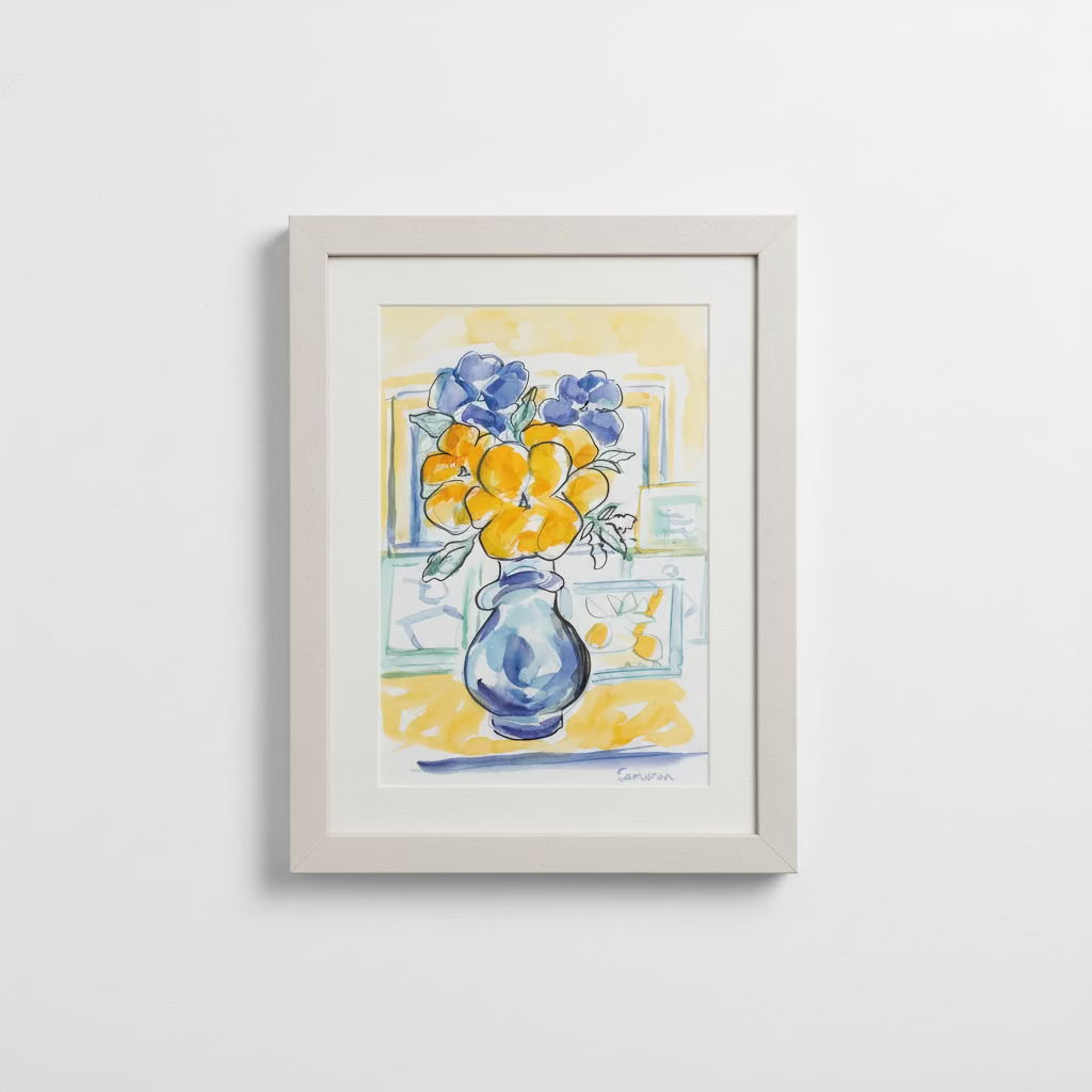 A framed watercolor painting of a blue vase with yellow and purple flowers, displayed on a white surface against a textured beige wall.