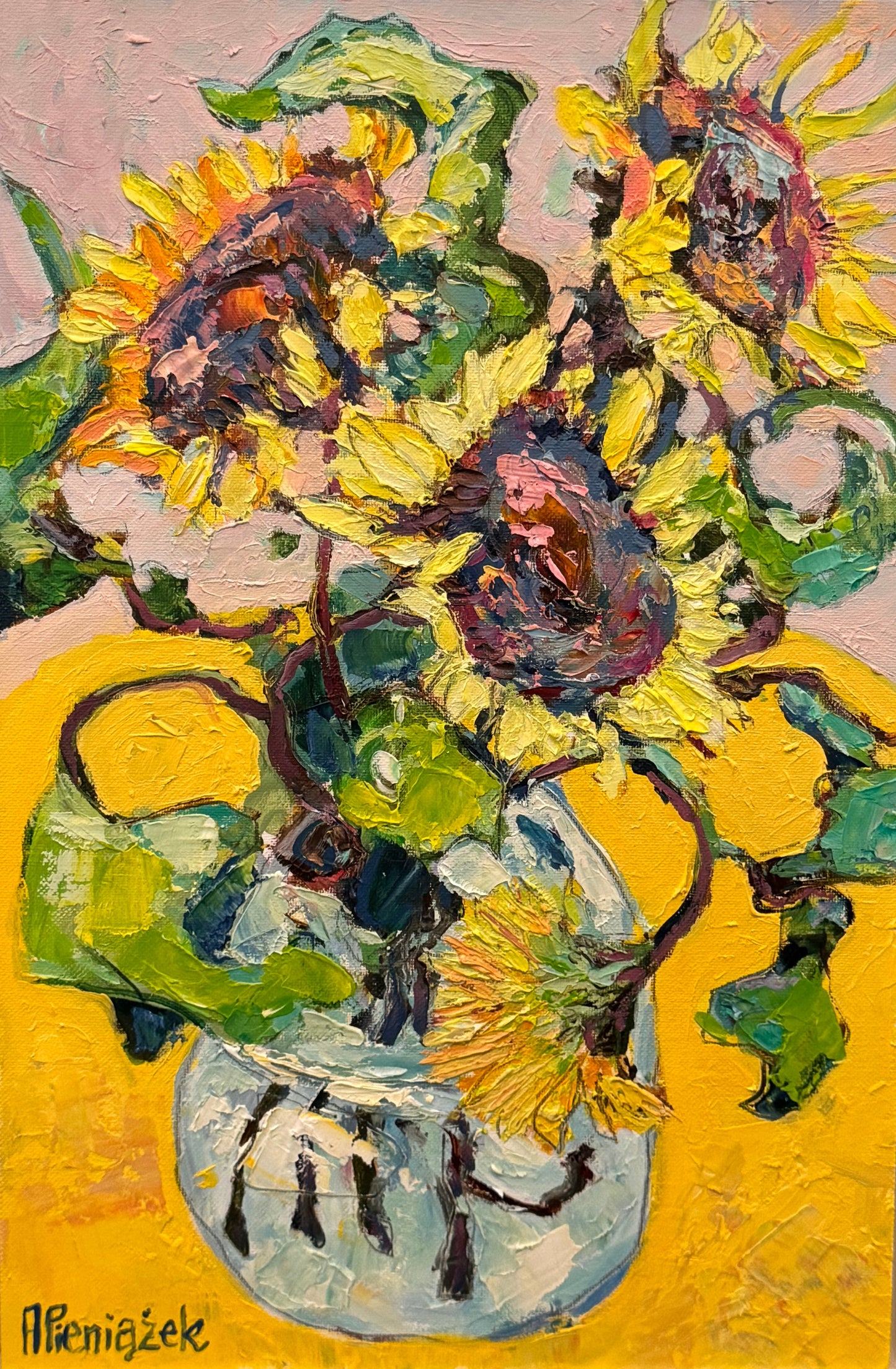 Framed painting of sunflowers with a signature in the corner.
