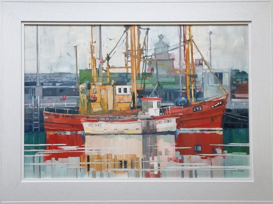Framed artwork of a harbour scene with boats and industrial elements.