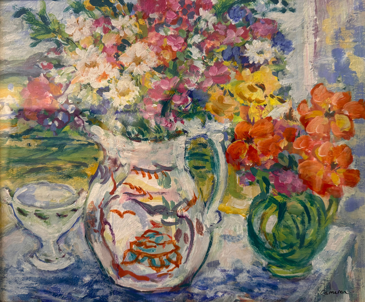 Framed still life oil painting featuring a white pitcher and a green vase filled with colorful flowers, including pink, orange, yellow, and white blossoms, set against a blue and green background.