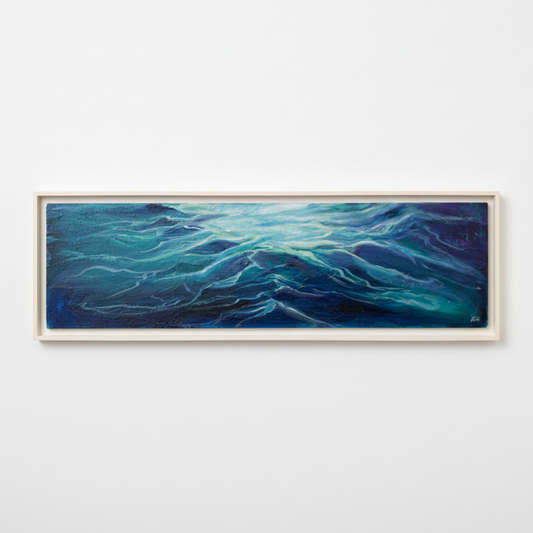 Framed abstract artwork with wavy blue patterns on a textured wall.