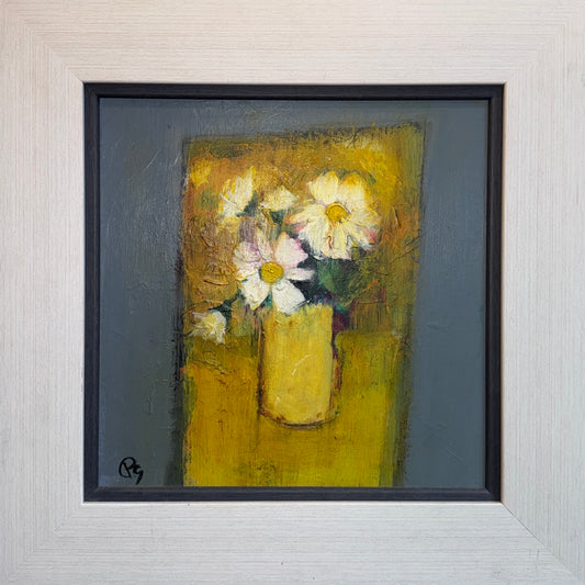 Framed painting of flowers in a yellow vase on a textured wall.