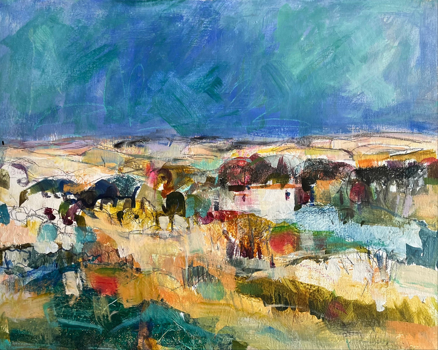 a colourful abstract painting of some fields with houses, trees and a blue sky.