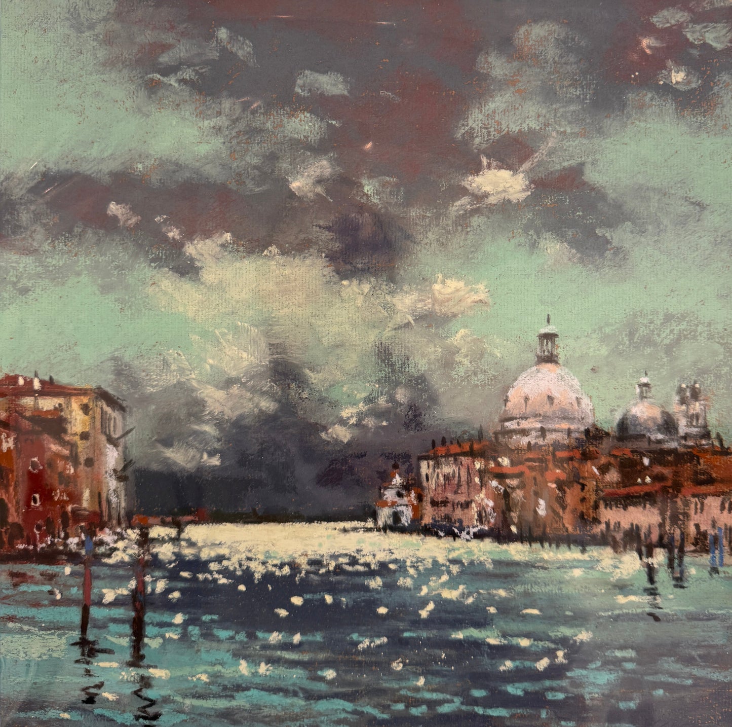 Framed artwork of a cityscape with a body of water, possibly Venice, on a light gray background.