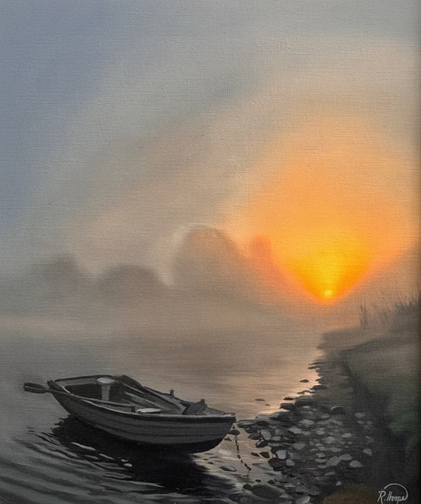 A framed landscape painting depicting a calm misty waterway at sunrise or sunset, with a small boat on the left and a bright orange sun over the horizon. The artwork is housed in a light-colored wooden frame.