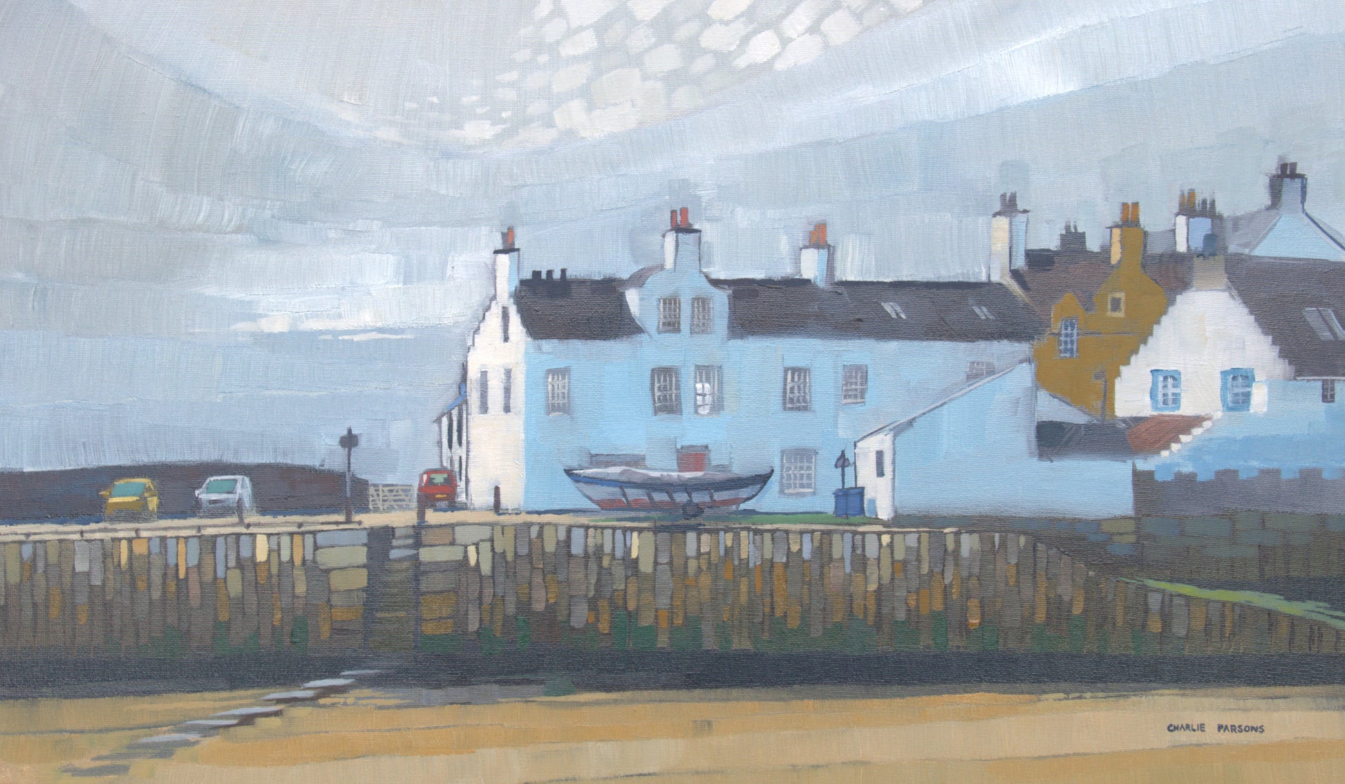 An impressionist-style painting of coastal houses along a harbor or road, with pale blue and white buildings, dark roofs, a wooden fence in the foreground, and a cloudy sky. A small artist signature appears in the lower right corner.