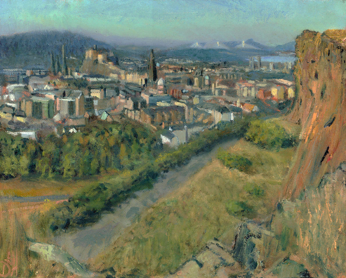 Impressionist-style landscape painting of a hillside city with buildings, a river or path running through the foreground, distant mountains, and a large rocky cliff on the right.