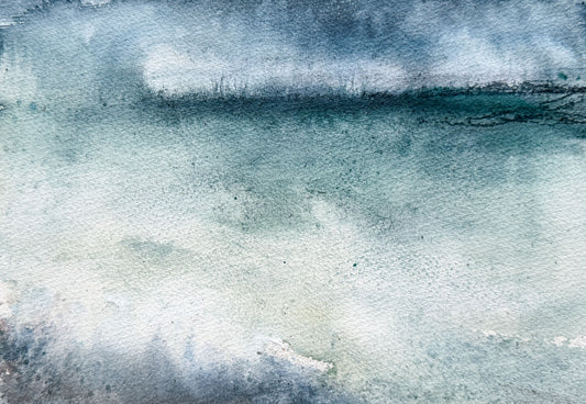 Abstract watercolor painting with blended shades of blue, teal, gray, and white, showing textured paper and soft horizontal tonal variation.