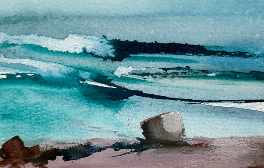 Watercolor painting of an ocean scene with turquoise and teal waves, white foam, a dark rocky shoreline, and a pale pinkish-beige foreground.