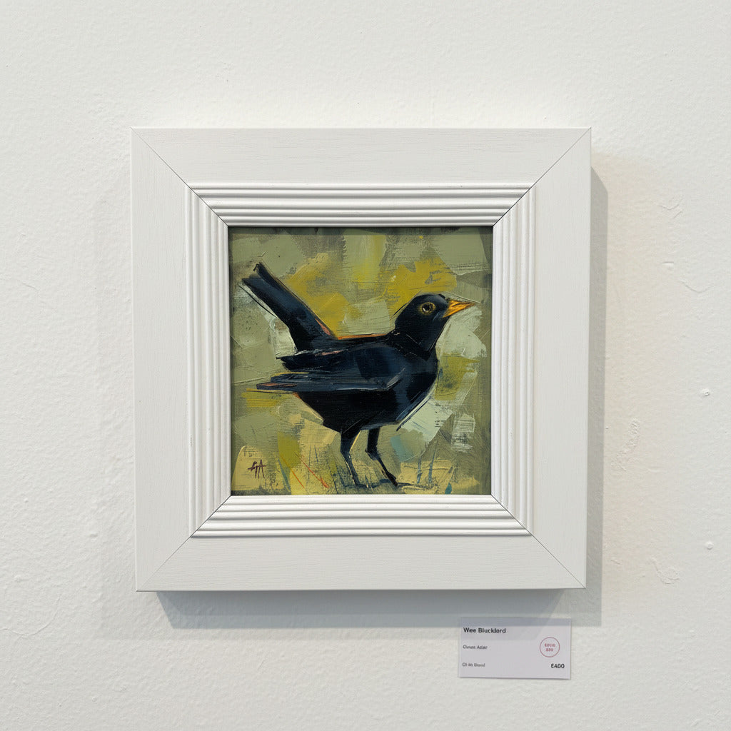 Framed painting of a black bird on a textured wall