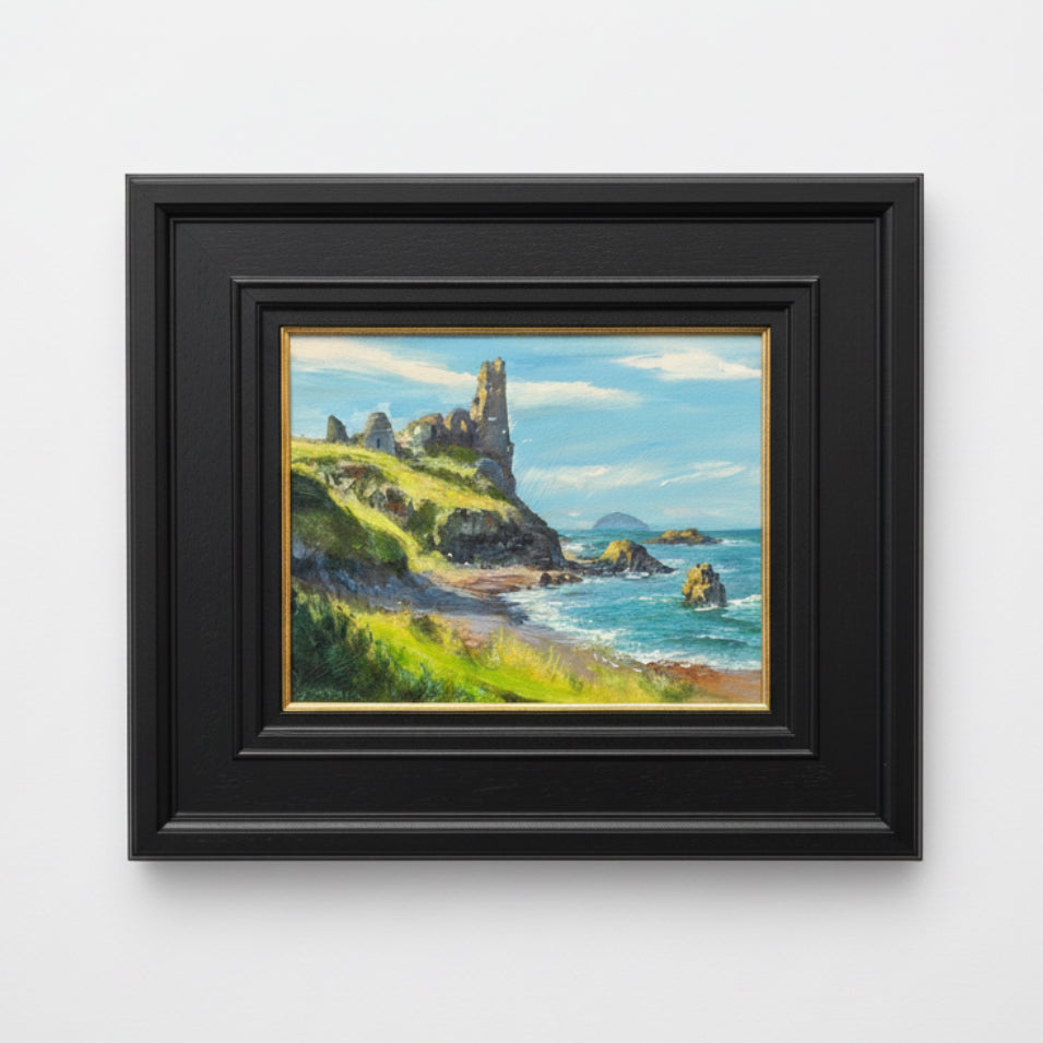 Framed painting of coastal landscape with cliffs and ocean.