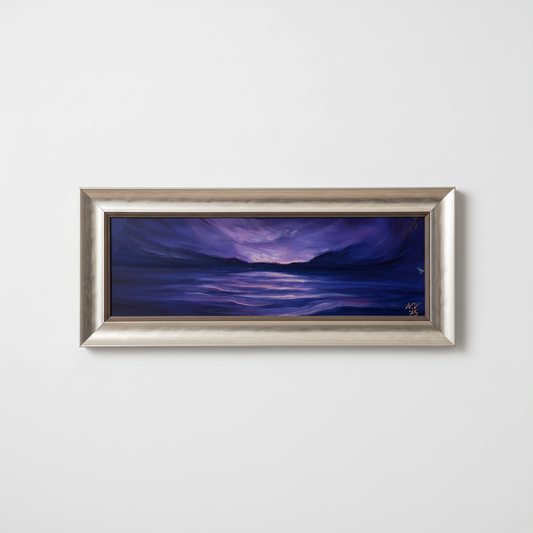 Framed painting of a purple landscape with a silver frame on a textured wall.