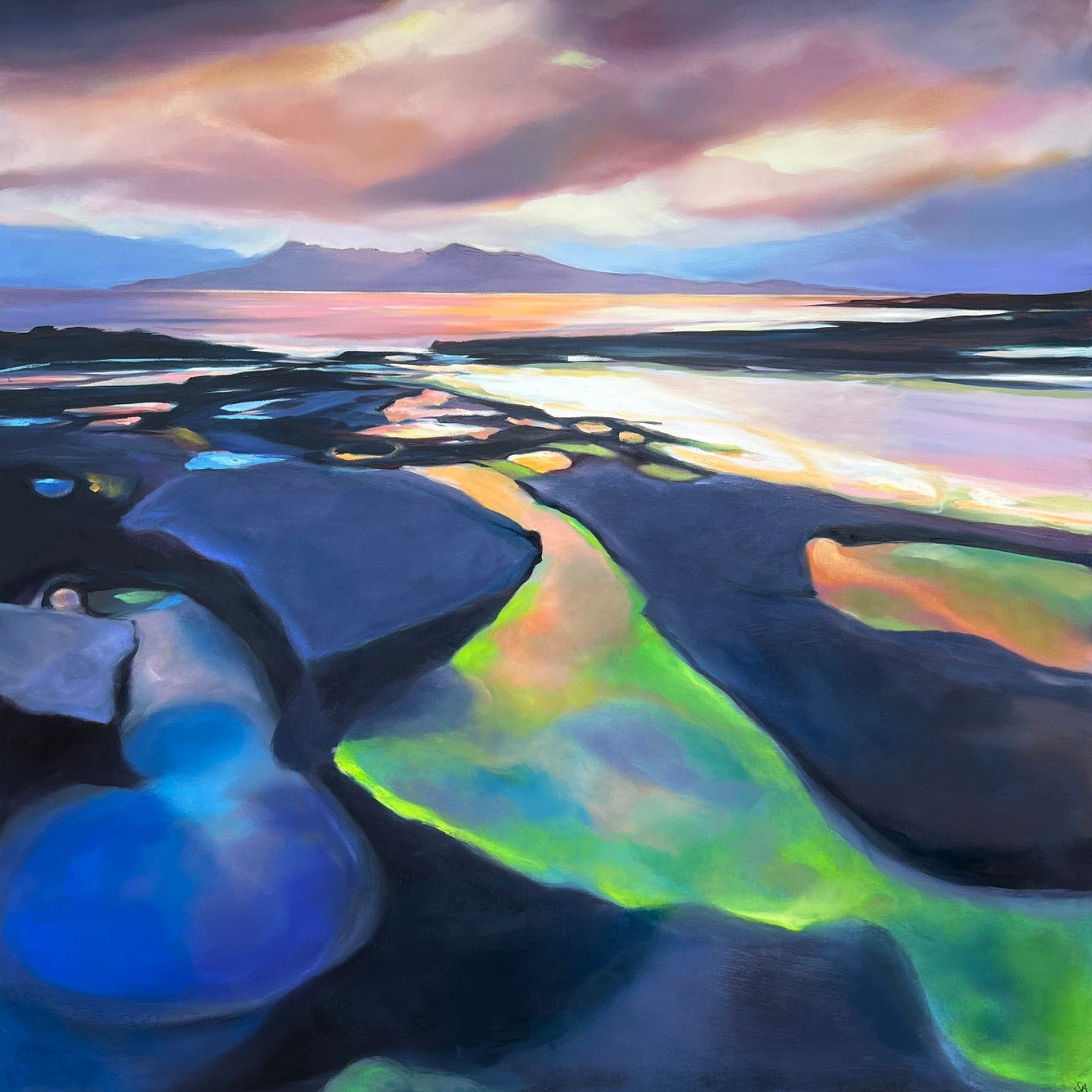 A framed abstract landscape painting featuring a dramatic sky with pink, purple, and blue clouds, a distant mountain range, and reflective water or salt flats in shades of blue, green, and gold. The painting is housed in a black frame and displayed against a dark wood background.