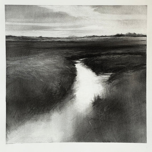 Black and white landscape with a river or stream flowing through a field.