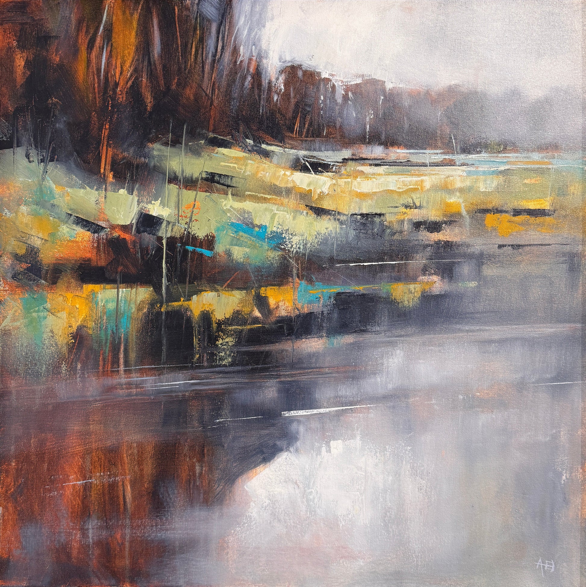An abstract framed painting hanging on a textured beige wall. The artwork features vertical brushstrokes in gray, black, white, yellow, blue, and brown tones, enclosed in a dark frame.