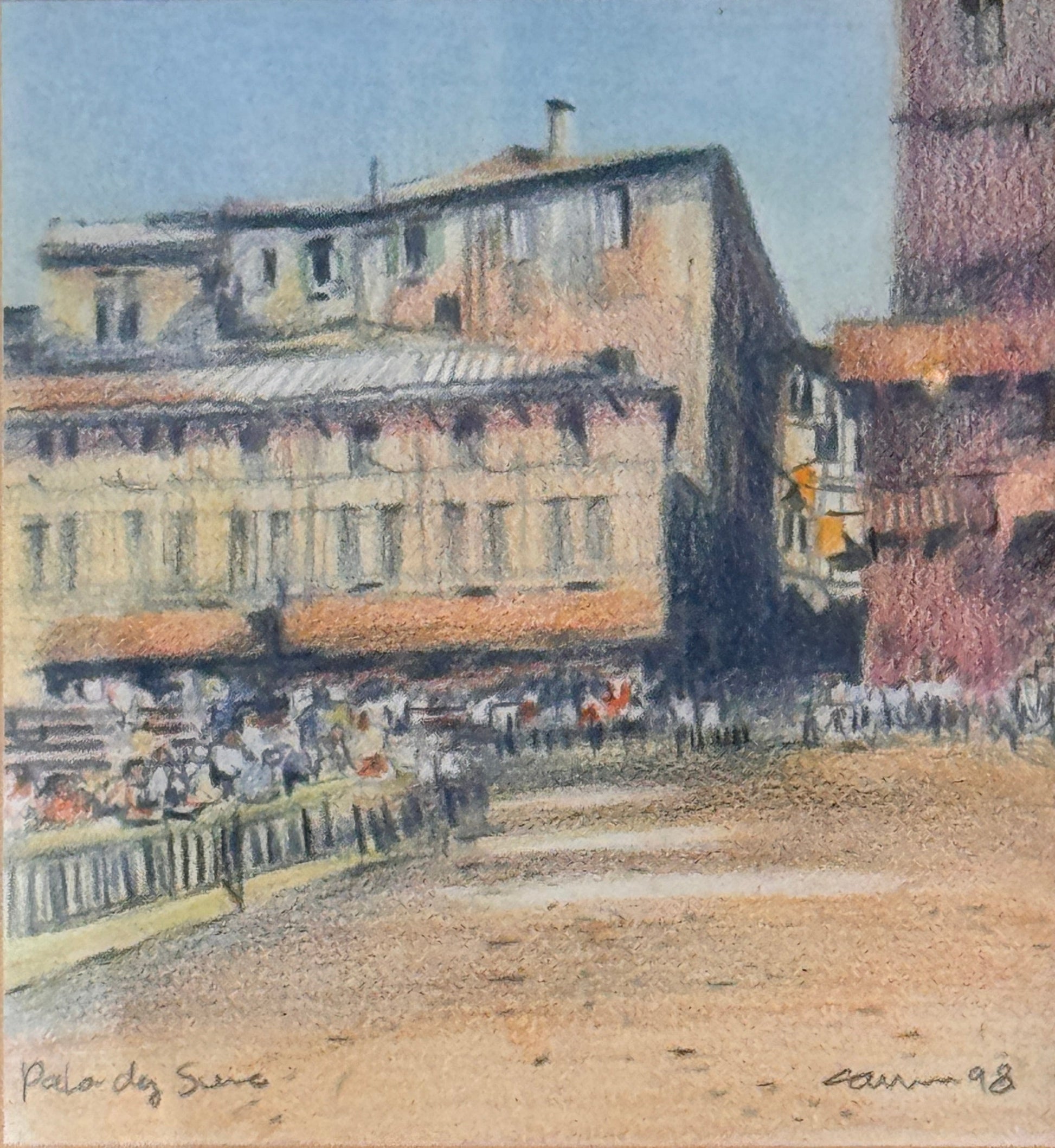 Framed artwork of a cityscape with buildings and a street.