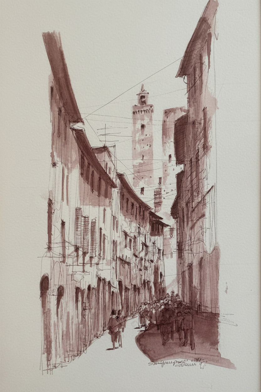 Framed architectural drawing of a building on a plain wall