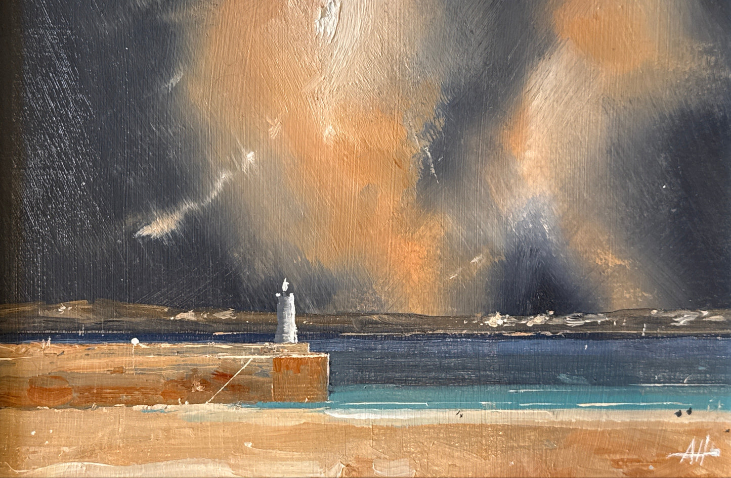 Painting of a lighthouse on a dock with dramatic sky, framed in white.