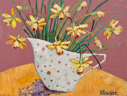 Artwork with flowers and a ladybird on a yellow table against a pink wall