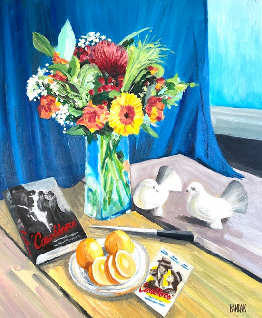 Still life painting with flowers, oranges, a book, and doves on a table against a blue curtain.
