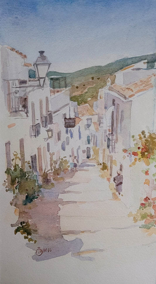 Painting of a narrow Andalucian street with white buildings and greenery