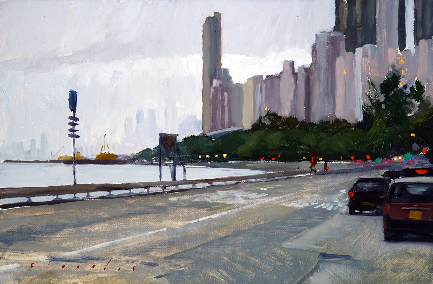 Cityscape with tall buildings and a waterfront, featuring a road with cars and traffic lights.