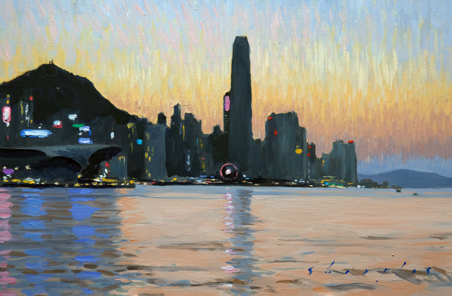 City skyline with a tall building reflected in water at sunset