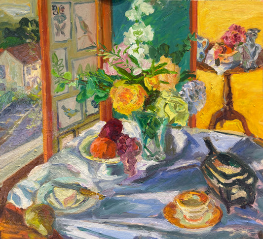Still life painting of a table with flowers, fruit, and a teapot, with a window view in the background.