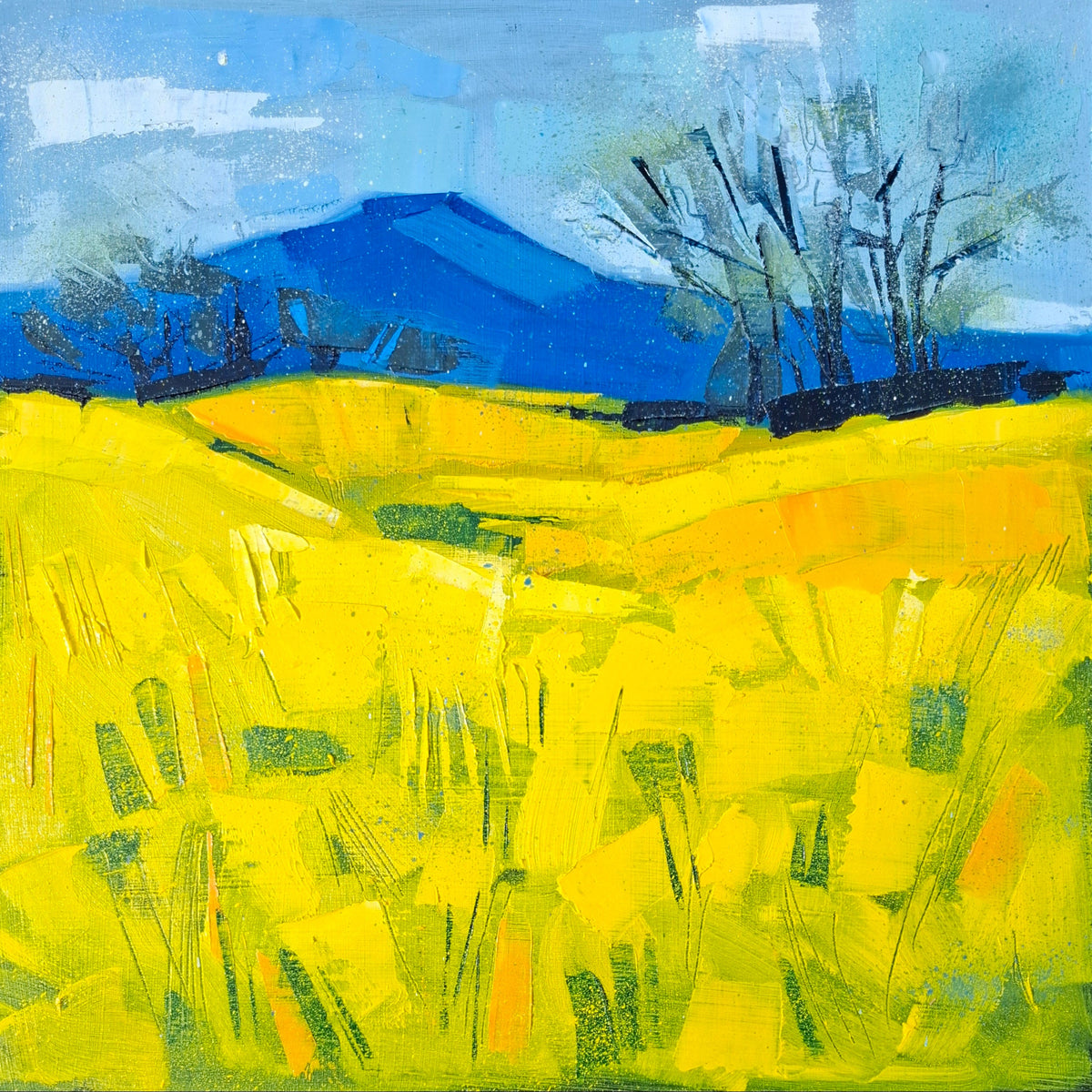 An abstract landscape painting featuring a bright yellow field in the foreground, a deep blue mountain in the background, and dark leafless trees against a blue sky.