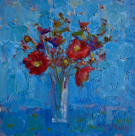 Painting of red flowers in a clear vase against a blue background