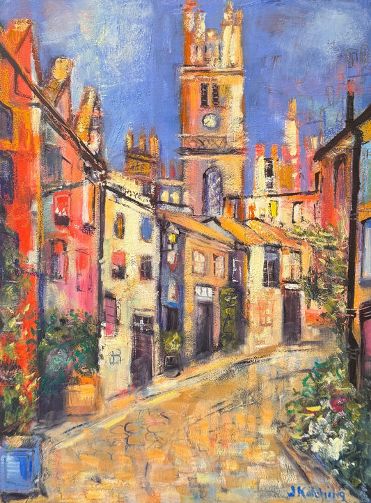 Framed painting of a colorful street scene