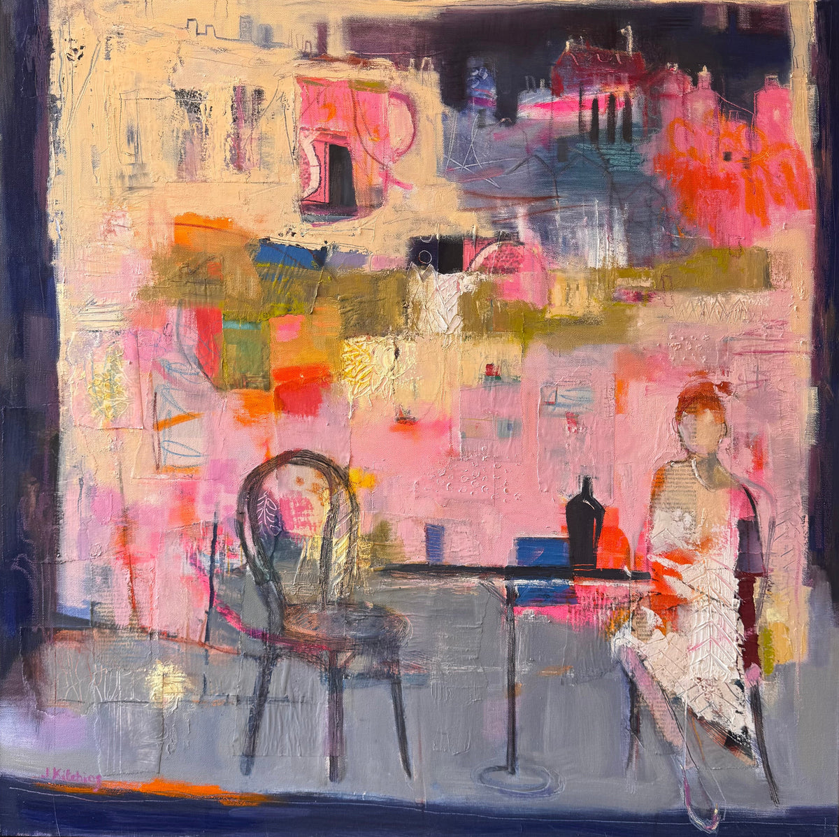 An abstract canvas painting depicting a cafe interior with two chairs, a table, and a seated woman, rendered in expressive brushstrokes of pink, blue, cream, orange, and purple. The painting is framed in a black frame and displayed against a neutral background.