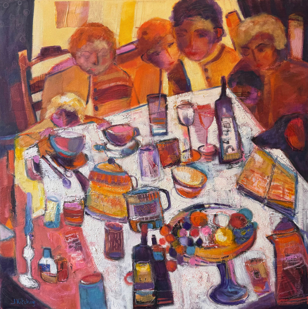 A framed square painting depicting a group of people seated around a table filled with drinks, bowls, and books, rendered in warm orange, red, yellow, and purple tones with a black frame.