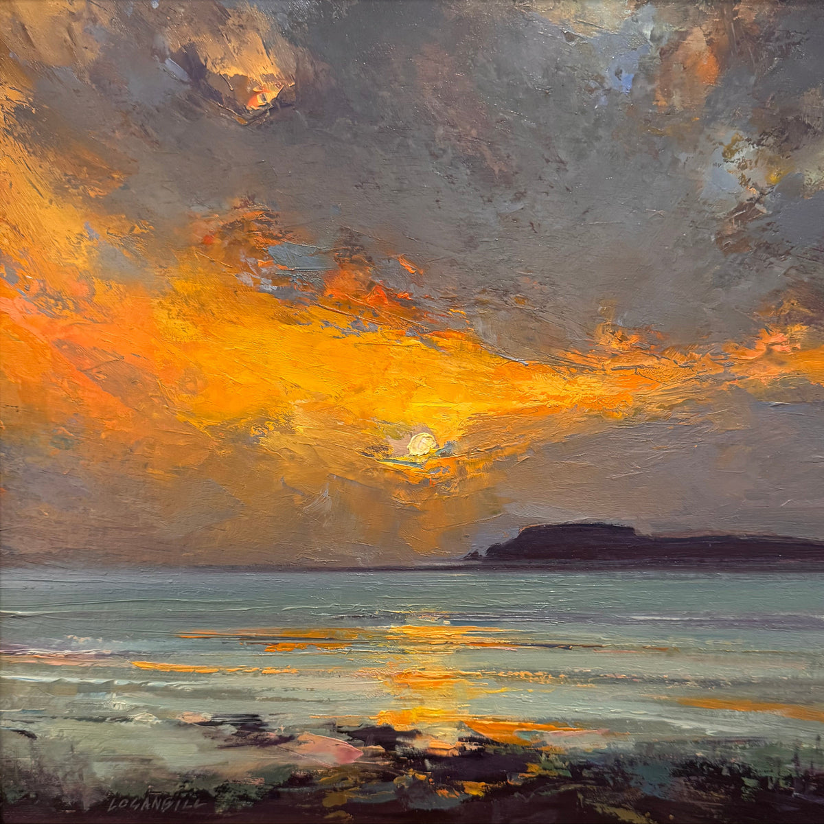 A framed oil painting of a dramatic sunset over the ocean, featuring vibrant orange and yellow clouds reflecting on the water, housed in a warm gold-toned wooden frame.