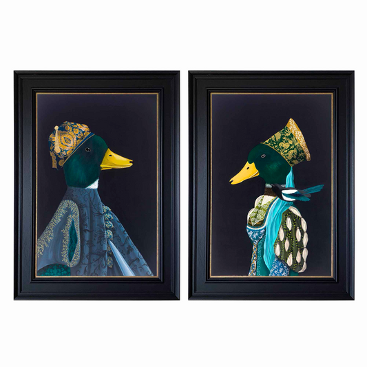 Two framed artworks of ducks with decorative headpieces and clothing on a white background
