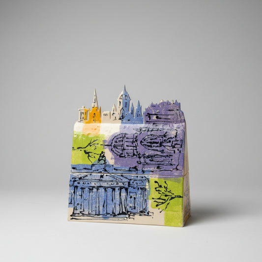 Decorative ceramin box with artistic design on a white surface