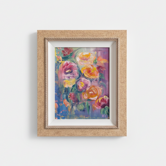 Framed painting of flowers on a white wall