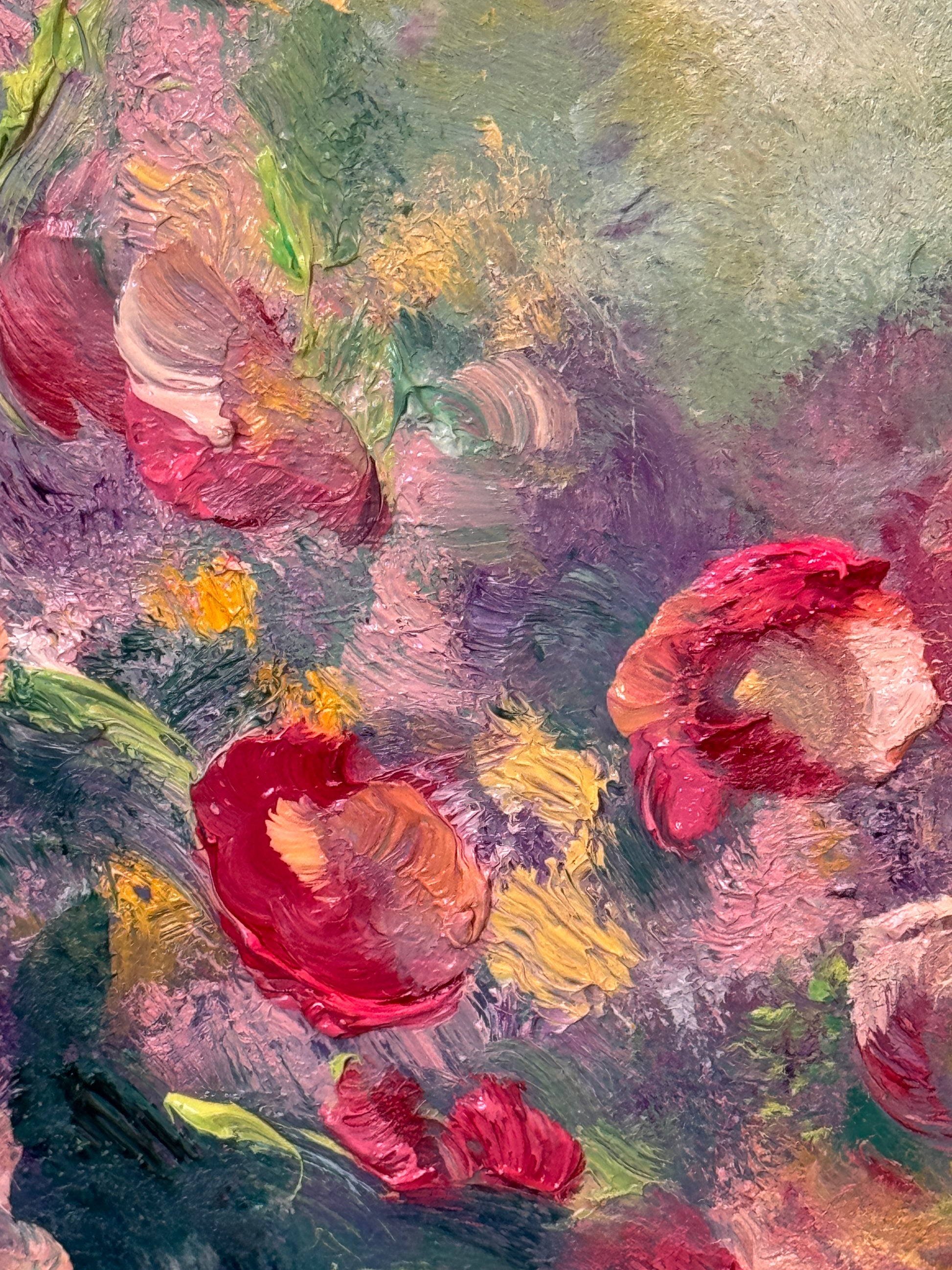 Abstract painting of flowers with a focus on red and pink hues.