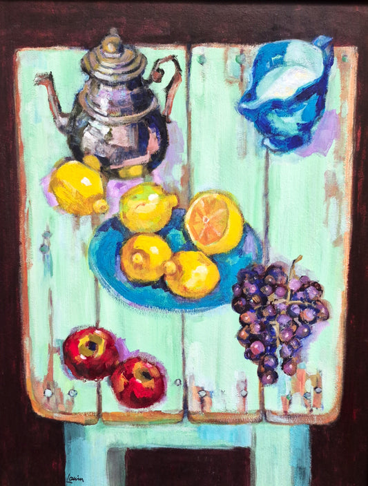 Still life painting with lemons, grapes, and a teapot on a green surface.