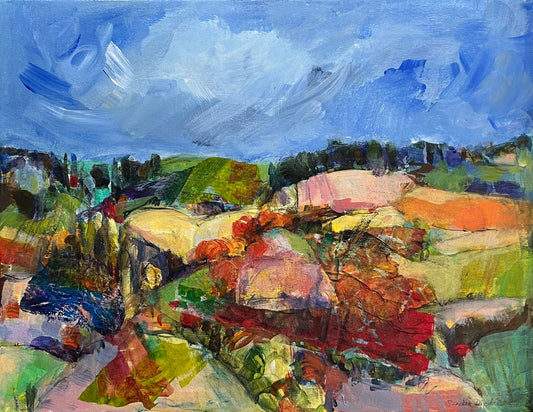a colourful mixed media painting of rolling fields of different colours, and a textured blue sky.
