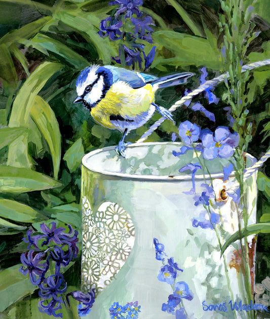 Bird perched on a decorative vase with purple flowers in a garden setting