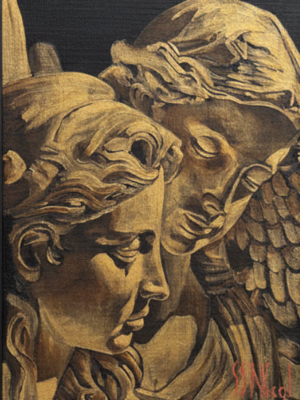 Carved stone sculpture of two angelic figures with detailed wings and hair.