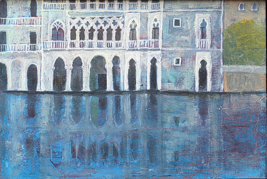 Framed artwork of a building reflection in water