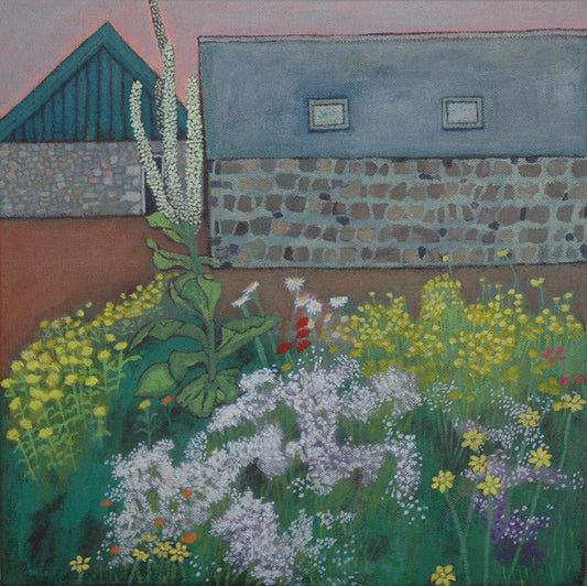 Garden scene with flowers and a building in the background